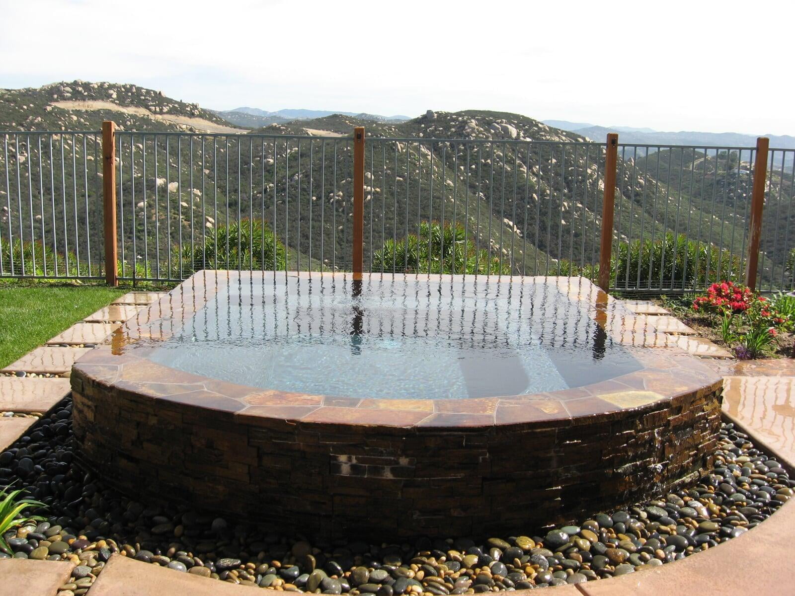 Spa with negative edge water feature